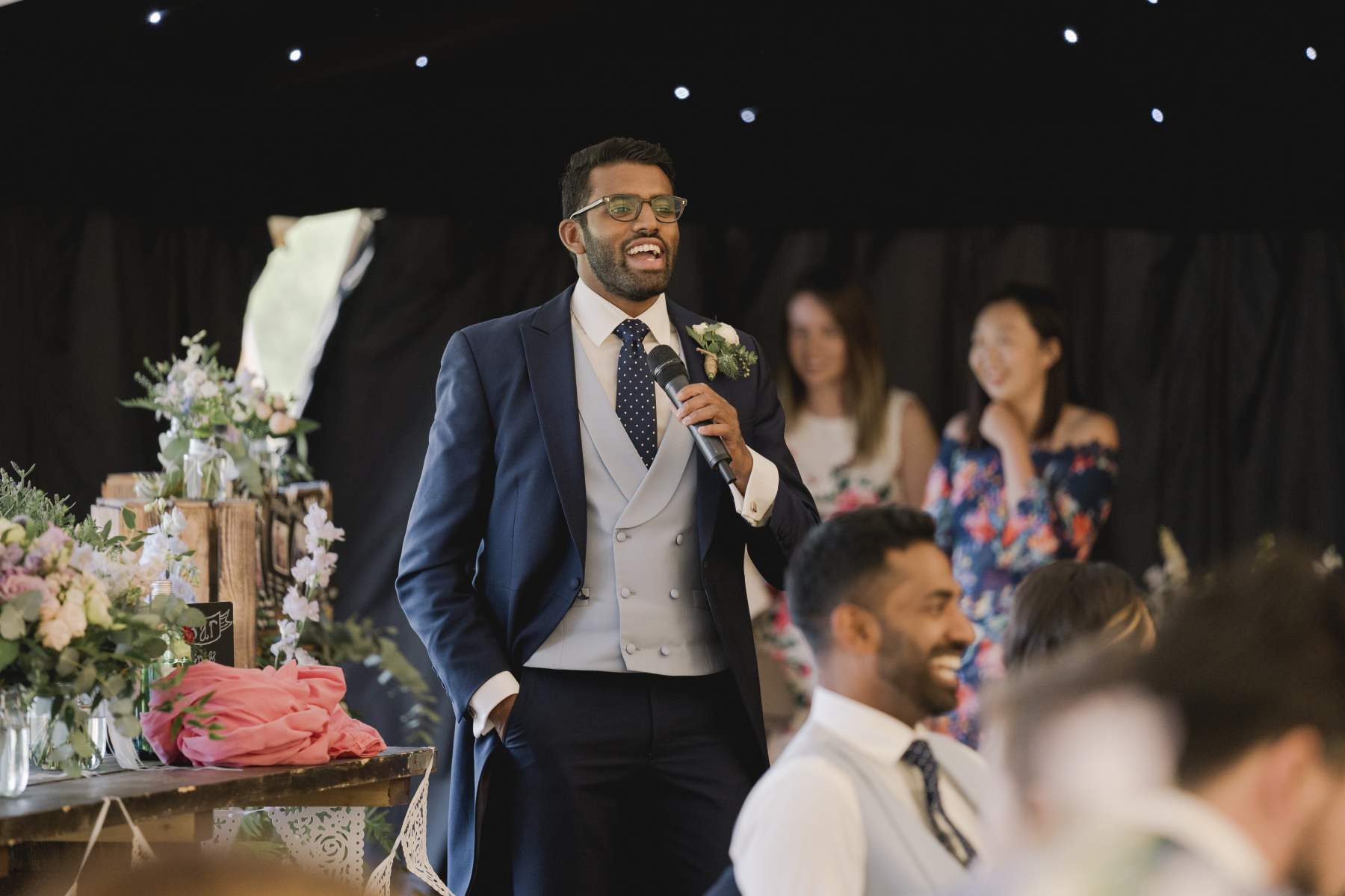 sailcloth wedding marquee Surrey king poles lined lanterns in roof round dining table hire and chairs wigwam marquees wedding