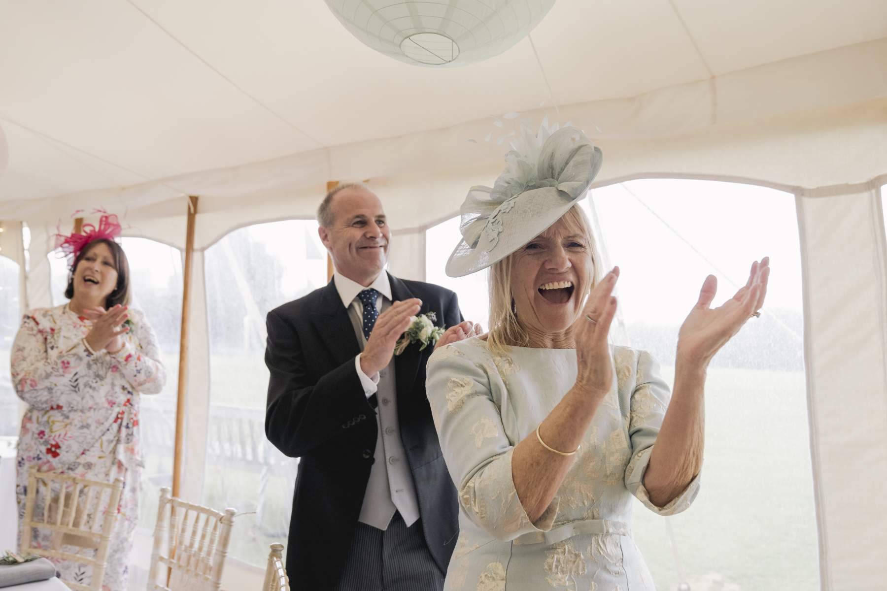 sailcloth wedding marquee Surrey king poles lined lanterns in roof round dining table hire and chairs wigwam marquees wedding