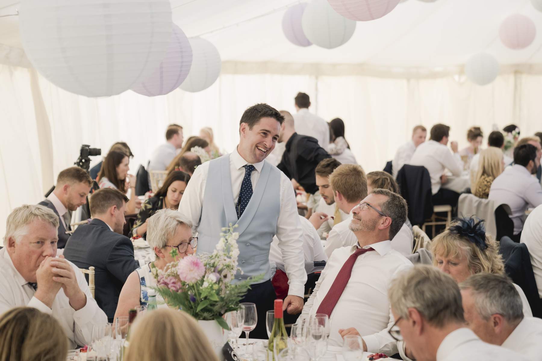 sailcloth wedding marquee Surrey king poles lined lanterns in roof round dining table hire and chairs wigwam marquees wedding