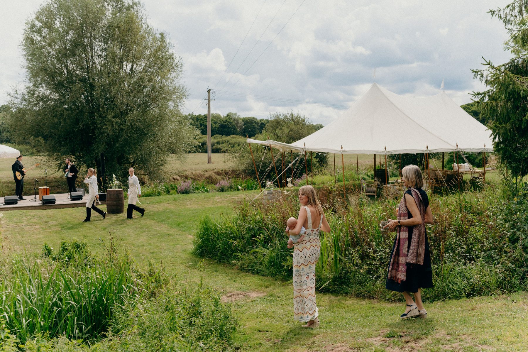Riverside cream canvas reception tent on the riverbank